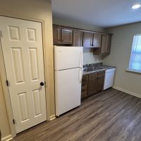 Woodland Hill - 2 bedroom, 1 bathroom unit - kitchen, refrigerator, sink, and pantry
